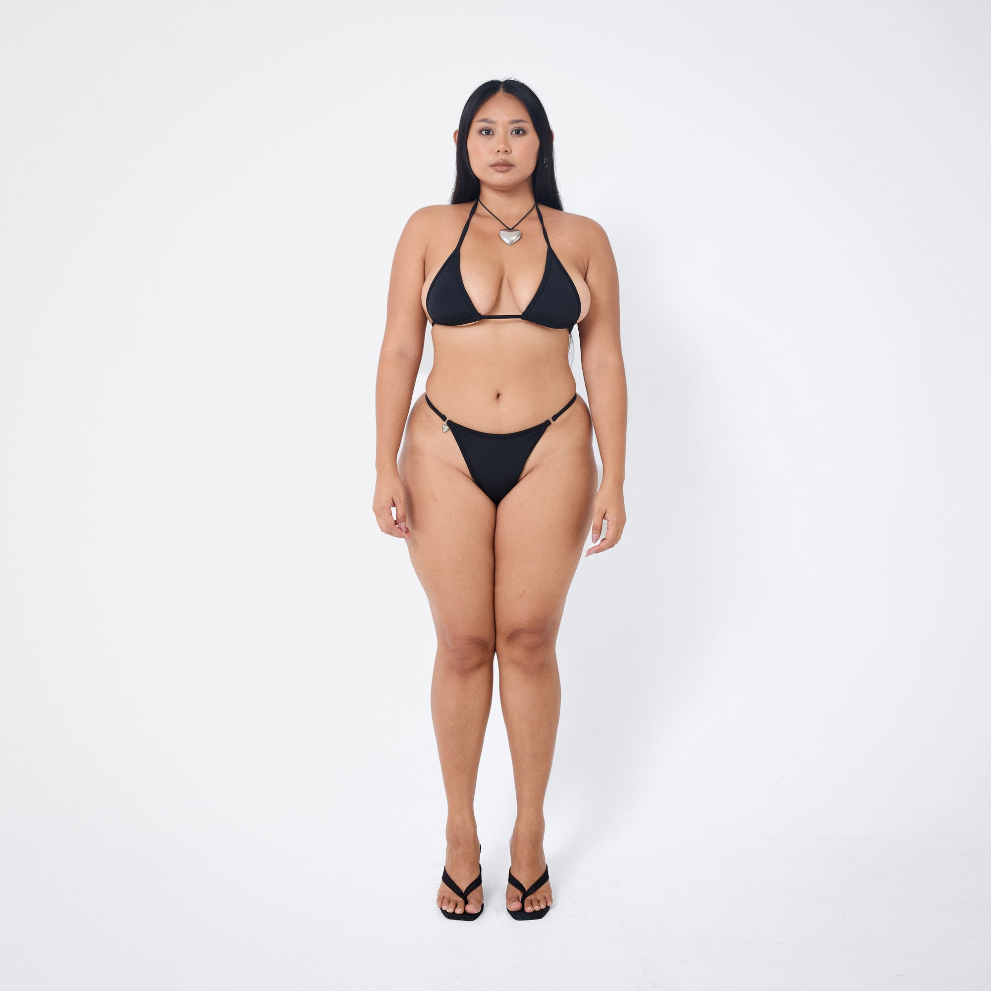 Arthur Apparel strappy bikini bottom in black with silver heart charm